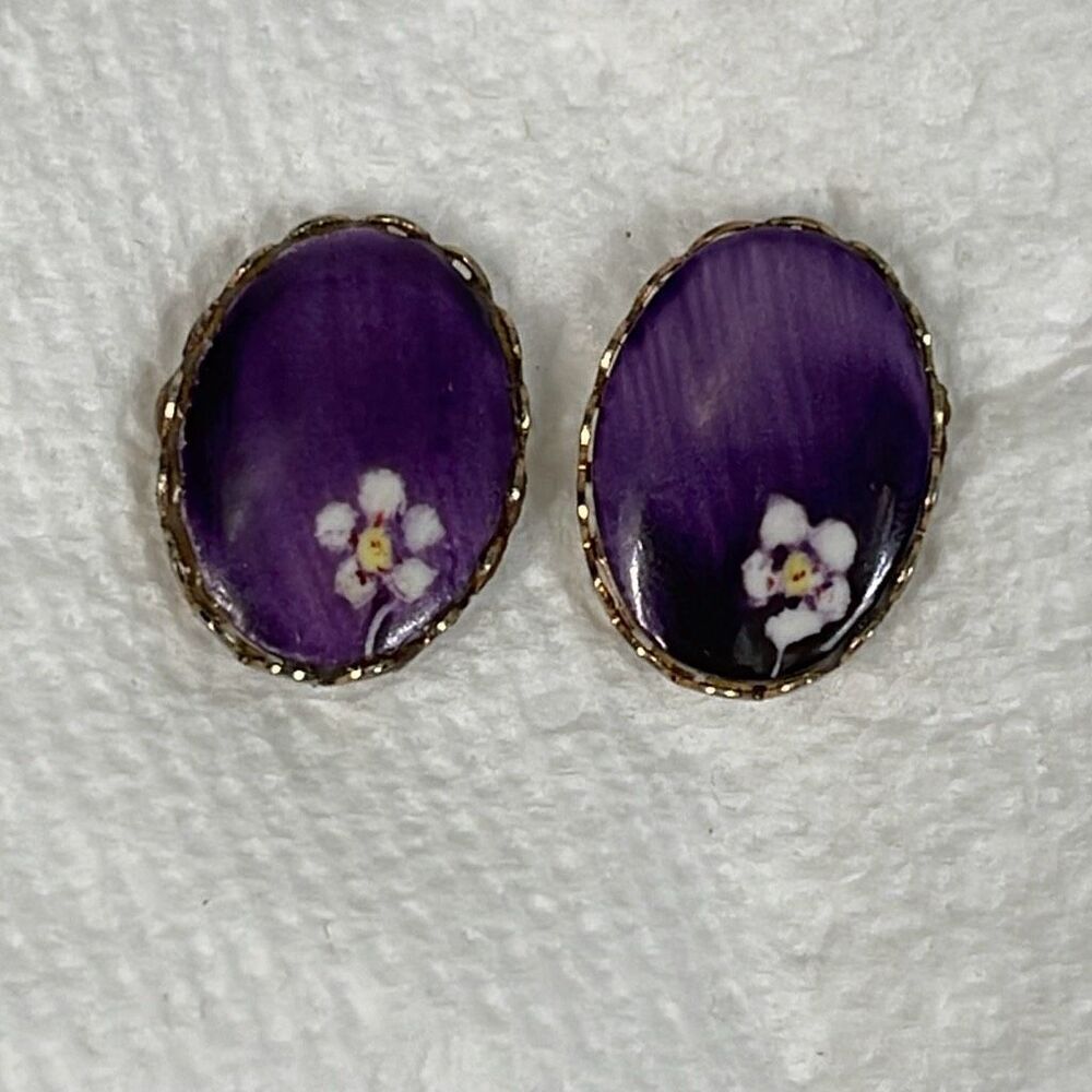 Vintage purple oval earrings with floral design.
